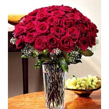 Two dozen Red Roses In A Vase.